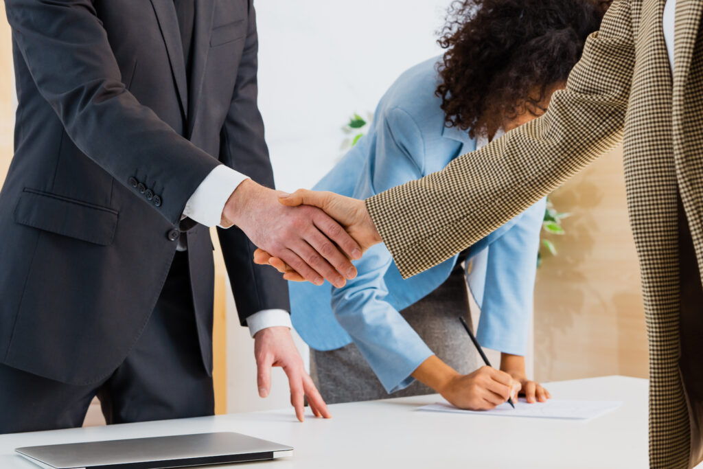 Group of multiethnic businesspeople shaking hands for a business